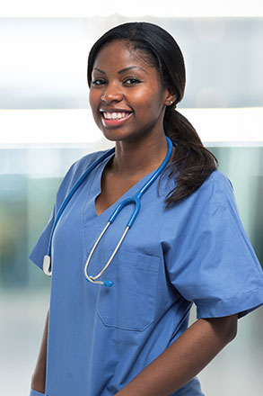 Practical Nurse standing in her scrubs