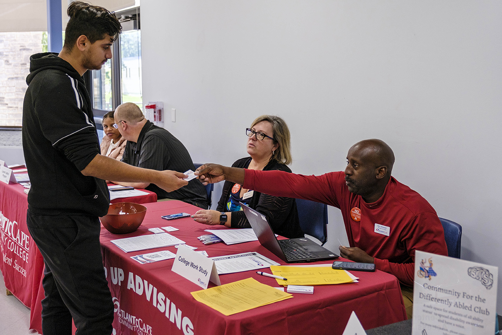 Students at a table with advisors