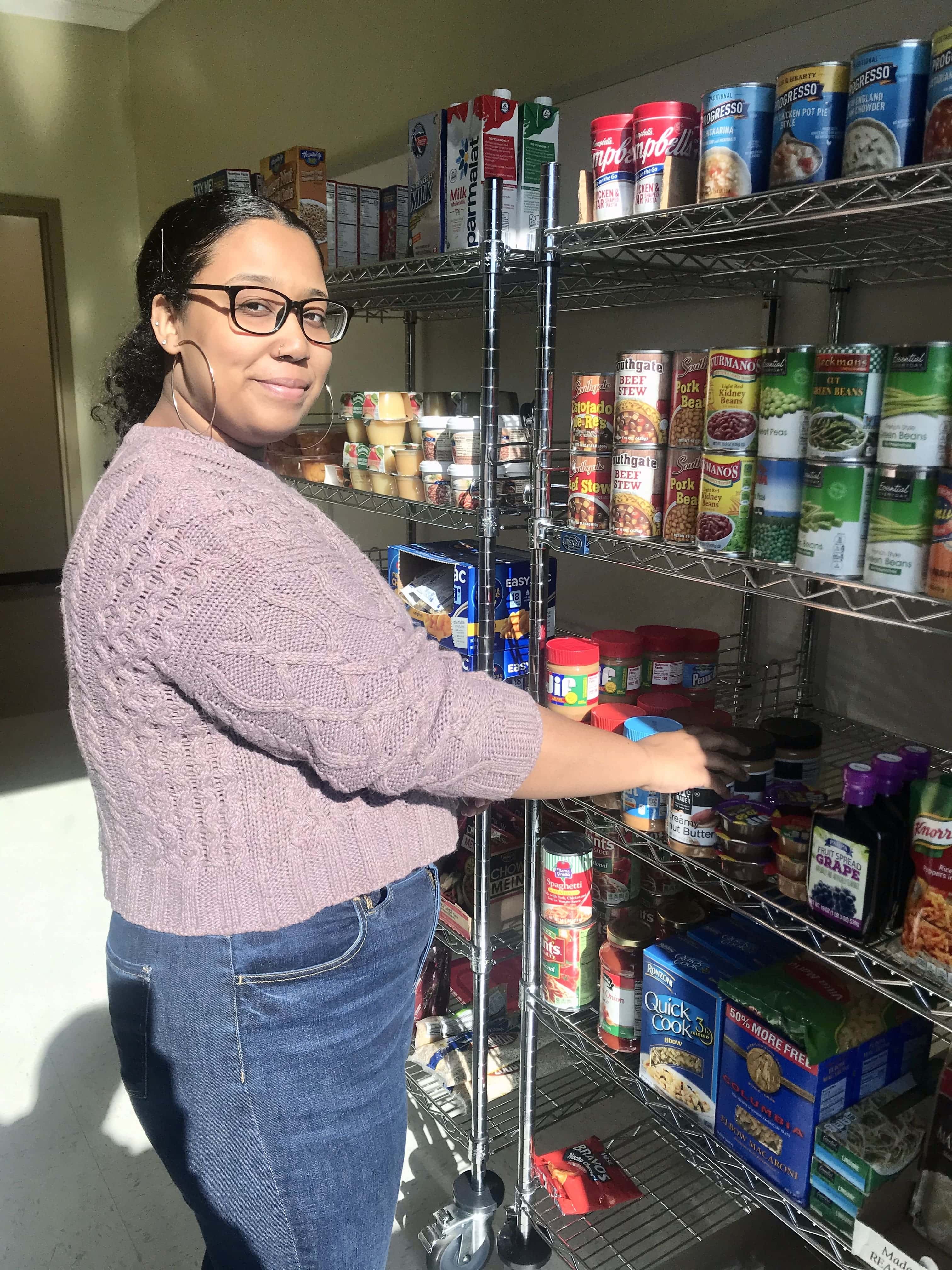 Food pantry worker stocking the shelves