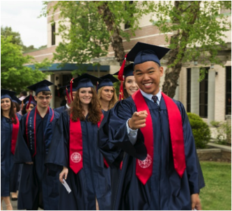 Students smiling during grad walk