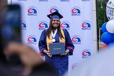 Female graduate holding diploma