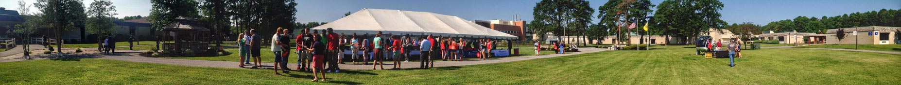 student under white tent