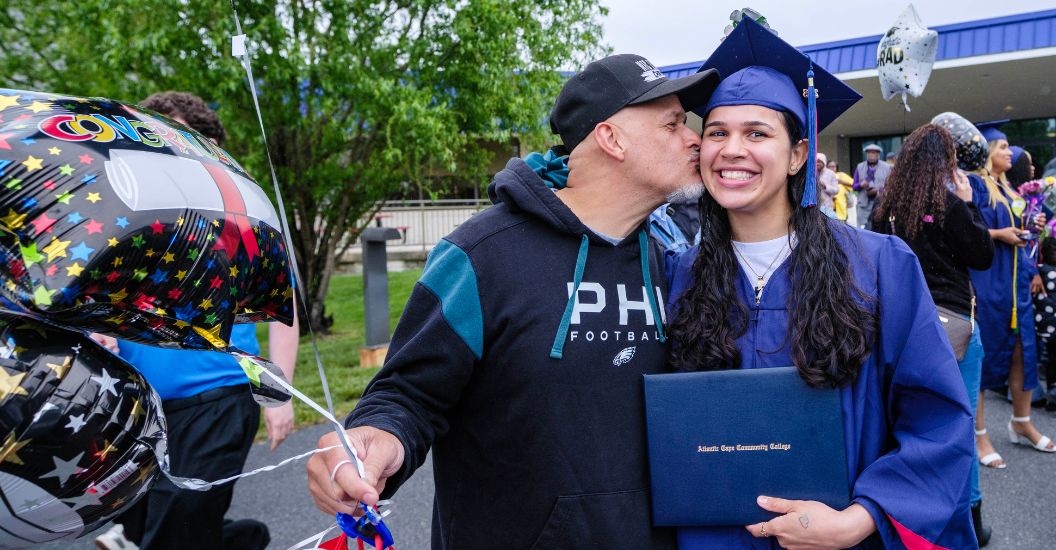 Graduate receives congratulations at 58th Annual Commencement ceremony