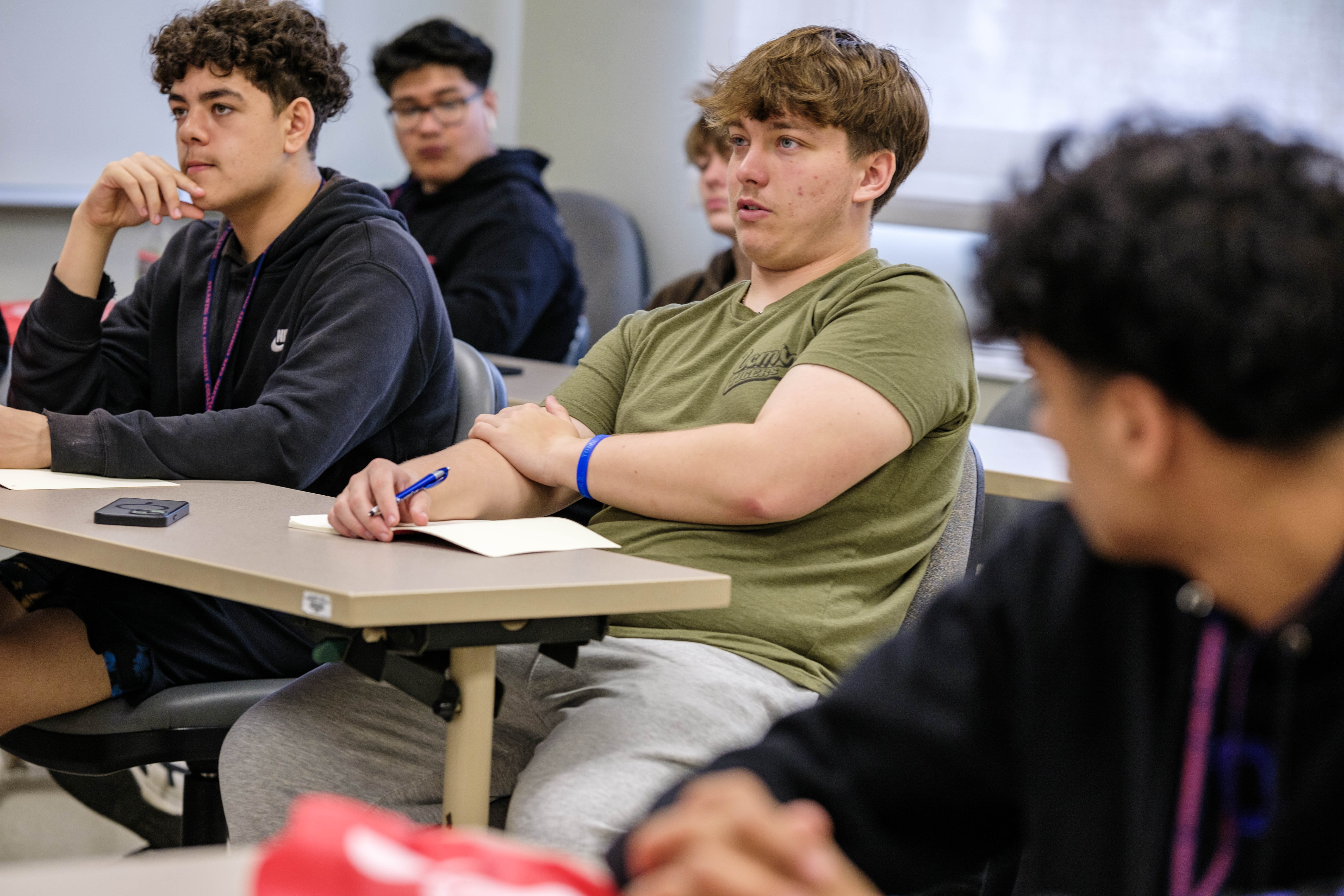 Students engaging with speaker during a workshop