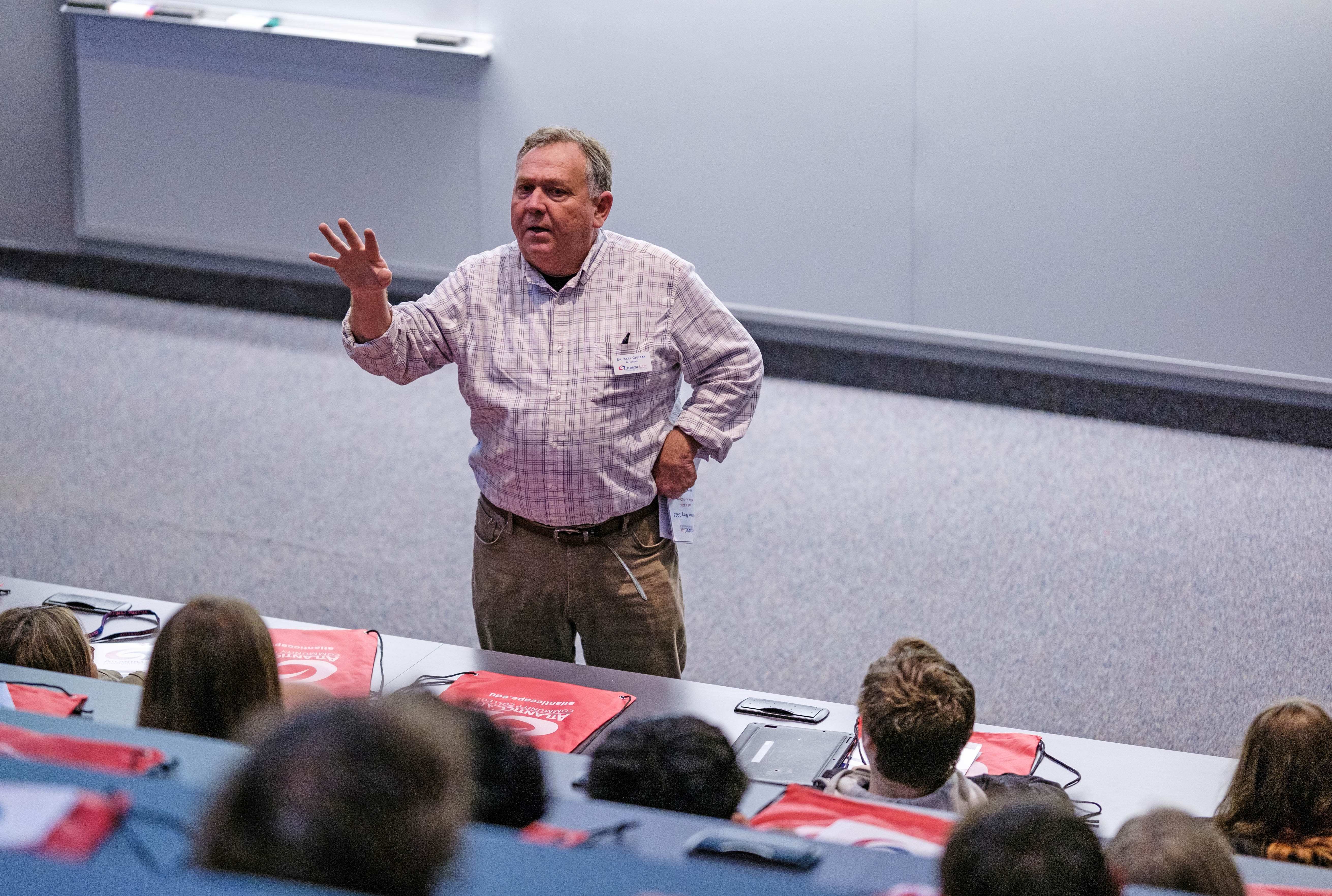 Dr. Karl Giulian speaks to the students at Business Day