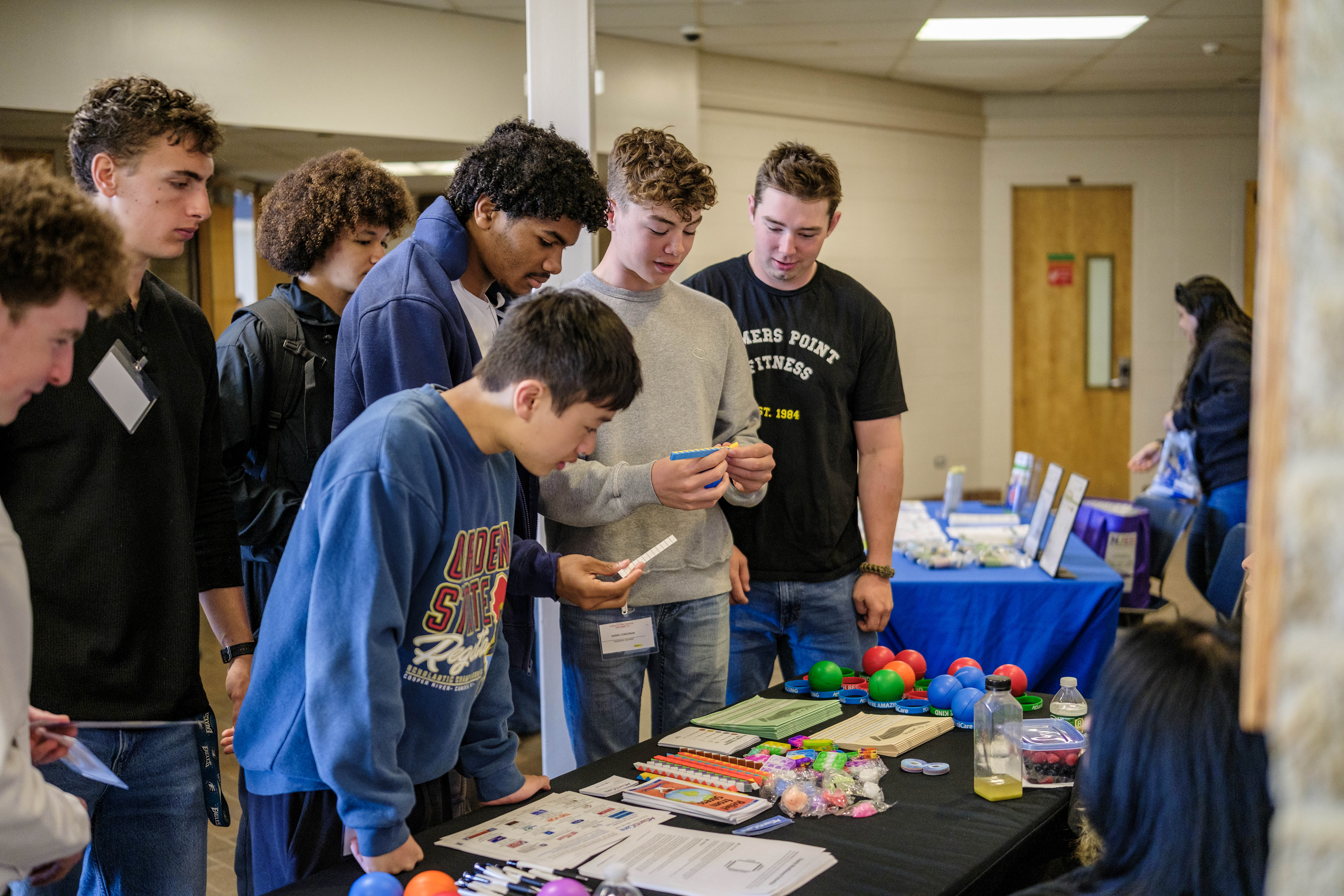 Students visit a vendor table