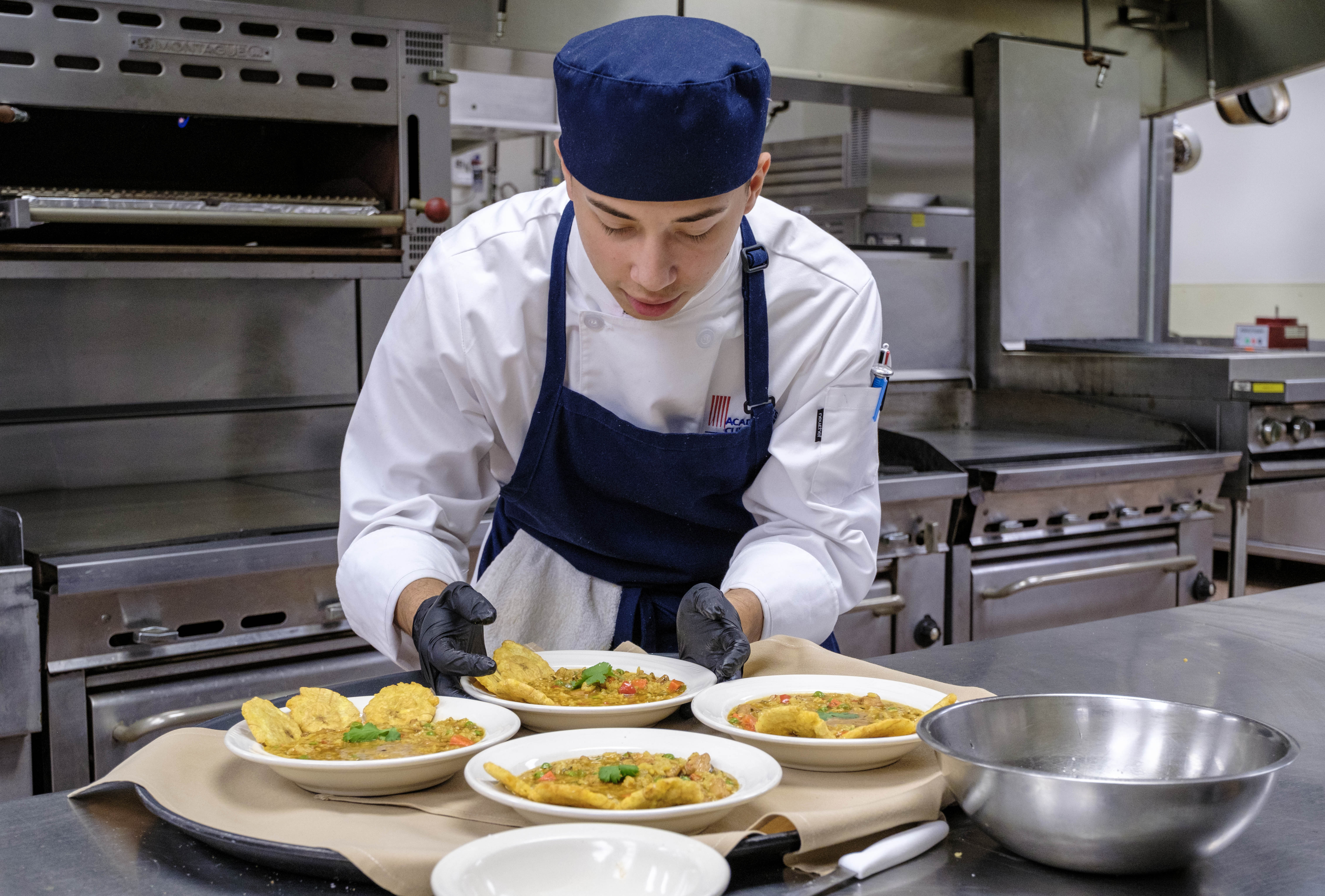 Culinary Arts student prepares a dish