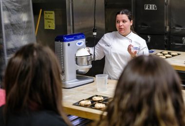 Chef Instructor Kirsten Leaming shows students how to make lemon meringue