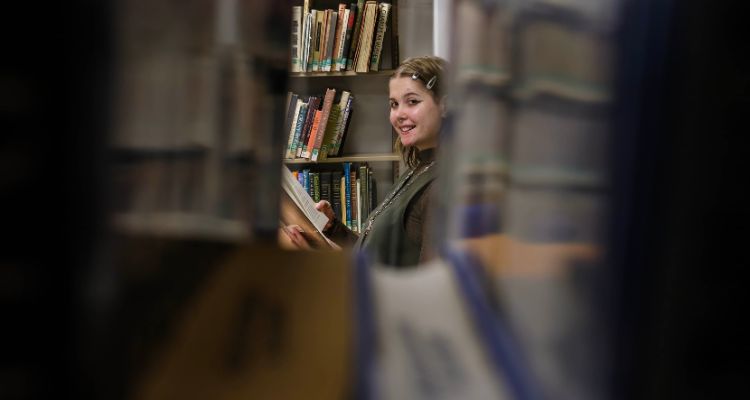 Atlantic Cape alumna Soleil Yakita in the William Spangler Library
