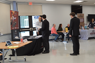 Students getting information at a professional development fair 