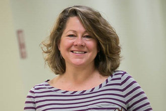 smiling woman in a nice shirt