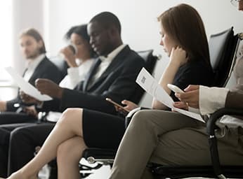 Prospective employees waiting in waiting room