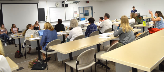 Attendees to summer institute listening to presentation by student panel. 