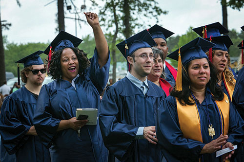 graduates throwing caps