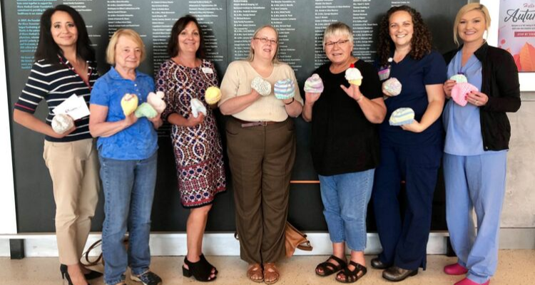 knitting group donates hats for babies to shore medical center