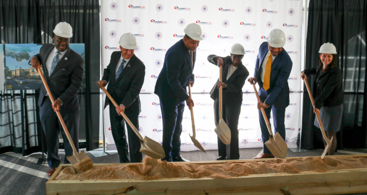 College officials shovel dirt in a ceremonial groundbreaking for the Wind Training Center at the Atlantic City campus