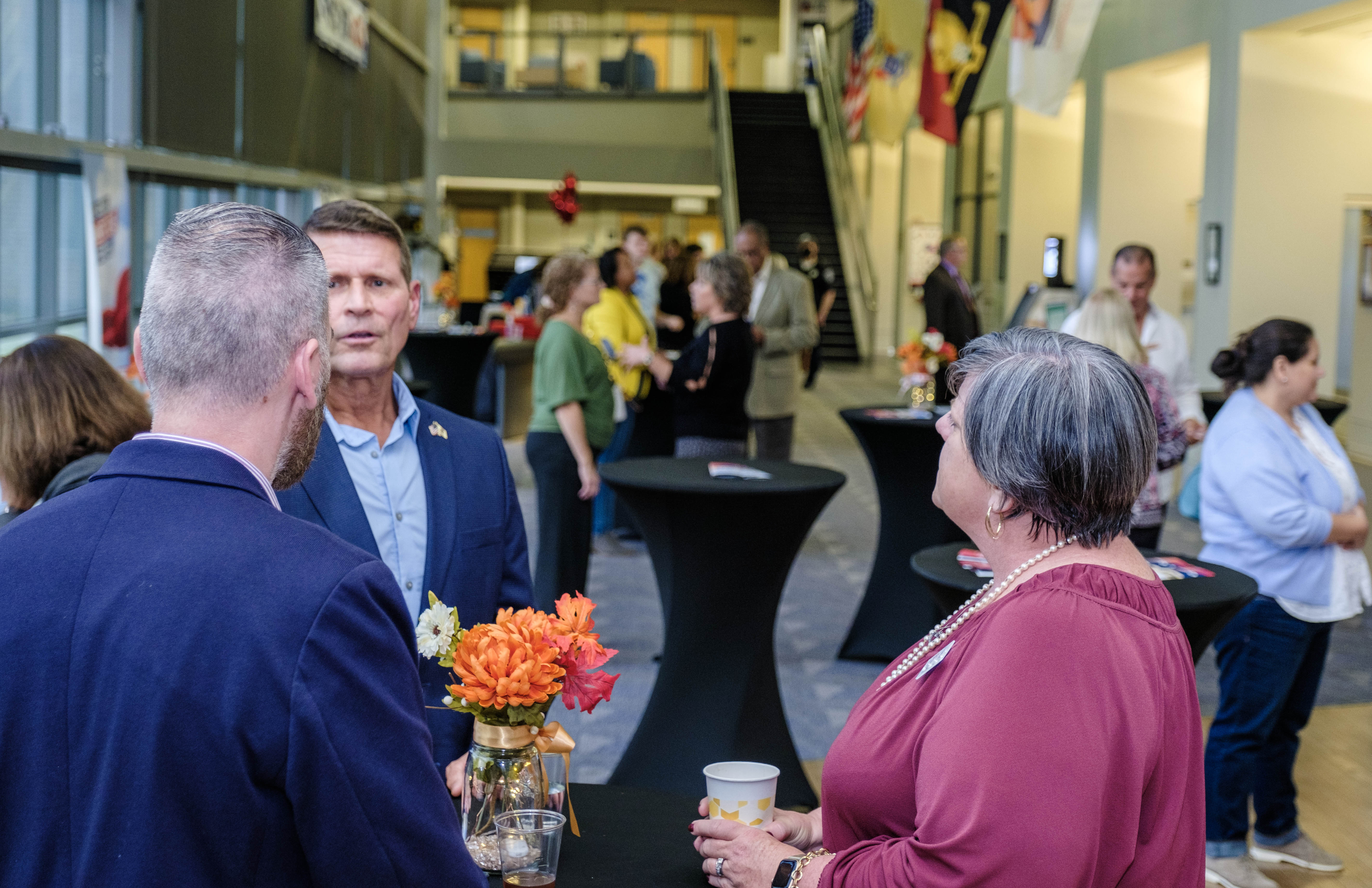 People mingling in the CMCC campus during welcome event.