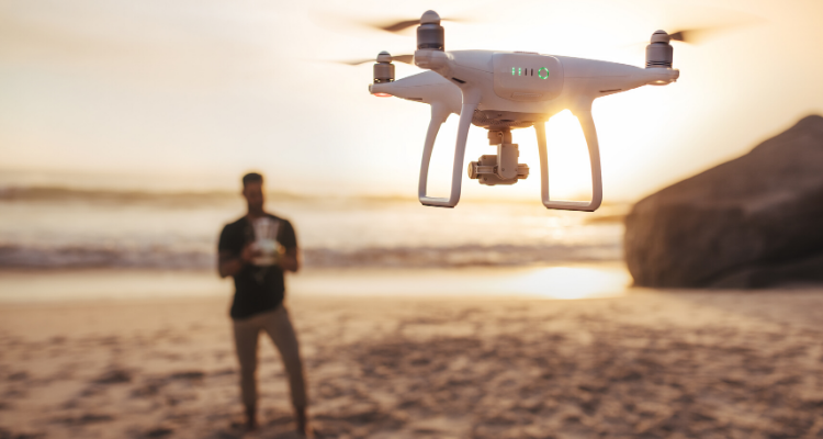 drone operator on the beach