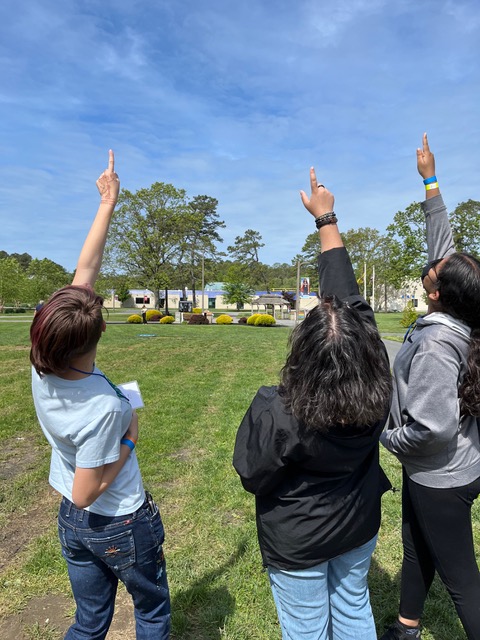  High school students Arabella Lankin (ACIT), Bianca Ruiz (ACIT) and Stephani Mejia (Pleasantville HS) point to their drone, which has climbed to 400 feet above the campus of Atlantic Cape in Mays Landing. 