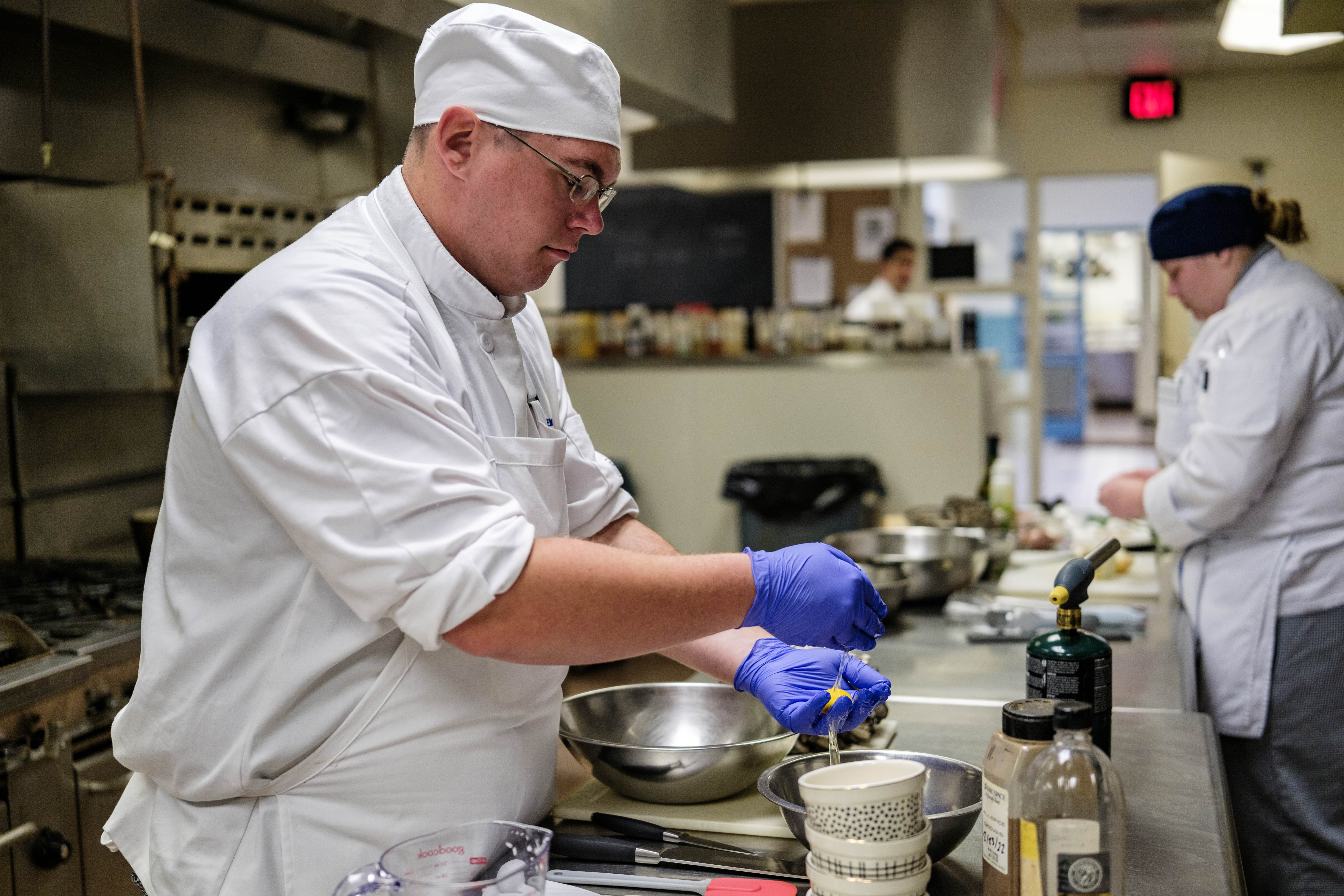 ACA student Austin Krautwald preparing his dish