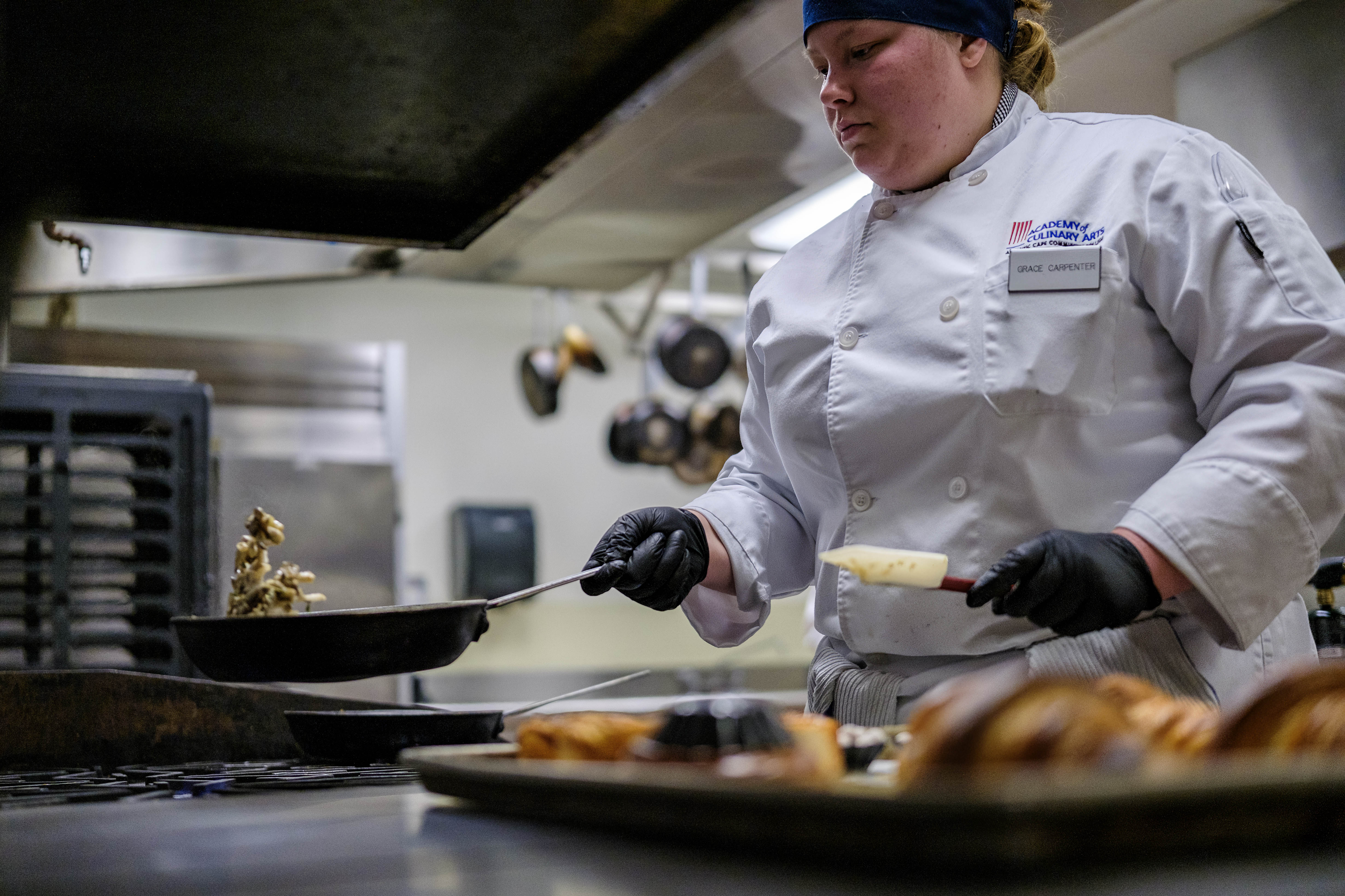 ACA student Grace Carpenter preparing her dish