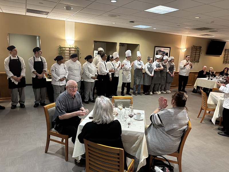 Chef Joseph Sheridan applauds his ACA students