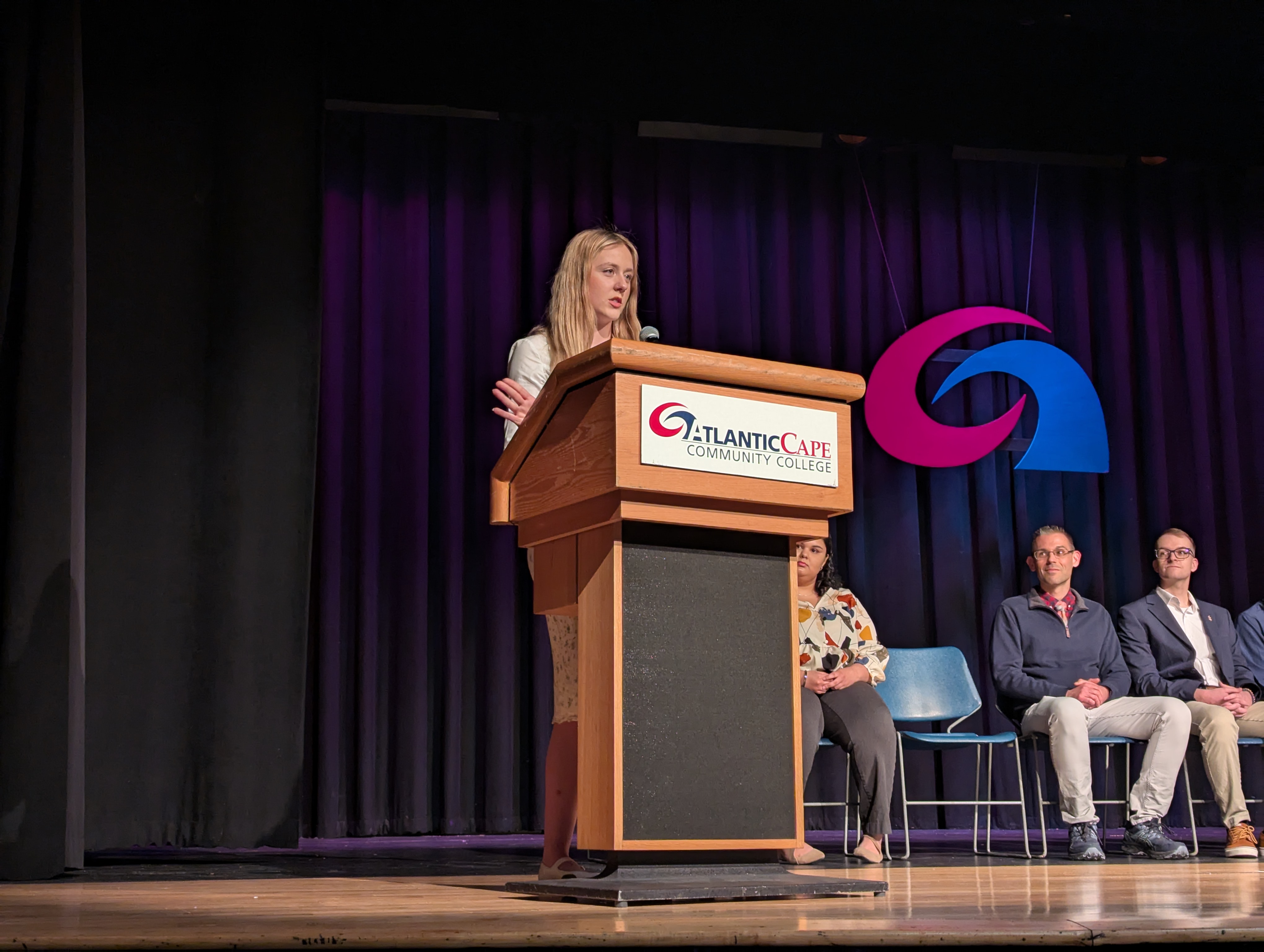 Briana Ebie speaks at the PTK induction ceremony