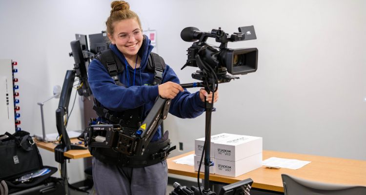 A Lower Cape May High School student tries out a Steadicam during a workshop on Media Day